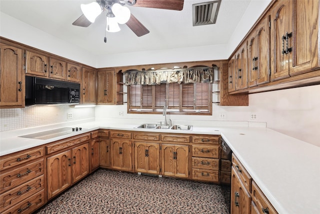 kitchen with backsplash, ceiling fan, sink, and black appliances