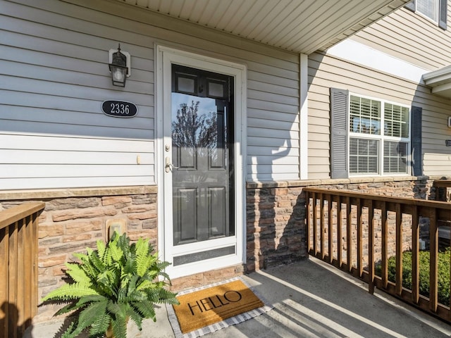 doorway to property featuring a porch