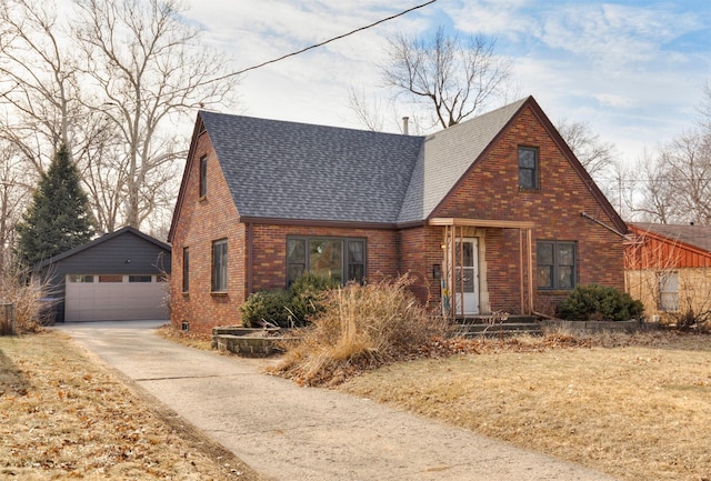 view of front facade featuring a garage and an outdoor structure