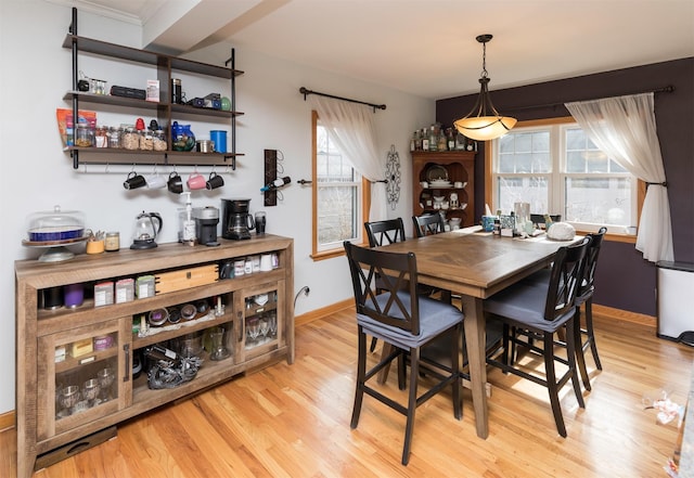 dining space with light wood-type flooring