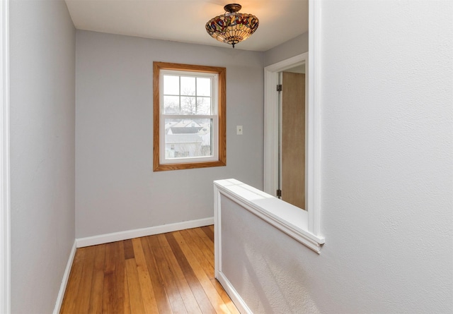 corridor featuring hardwood / wood-style flooring