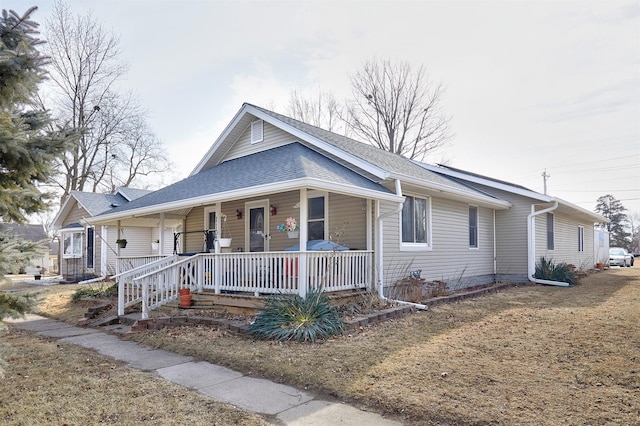 view of front facade with a front lawn and a porch