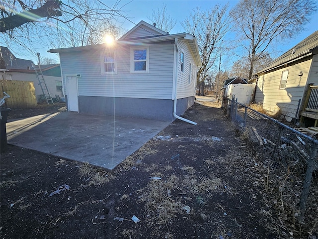 back of property with a patio