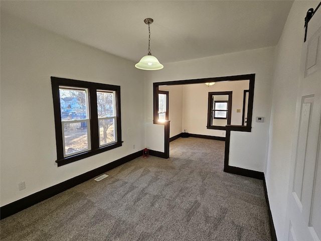 spare room featuring carpet flooring