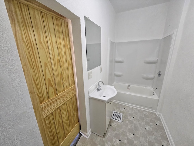 bathroom featuring shower / bath combination and sink