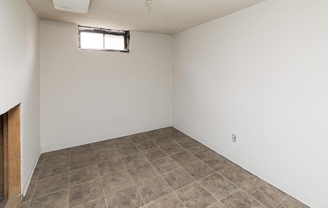 basement with a textured ceiling