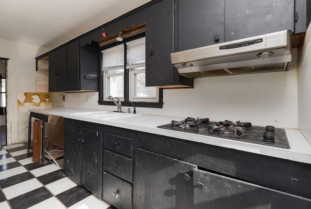 kitchen featuring white gas cooktop and sink