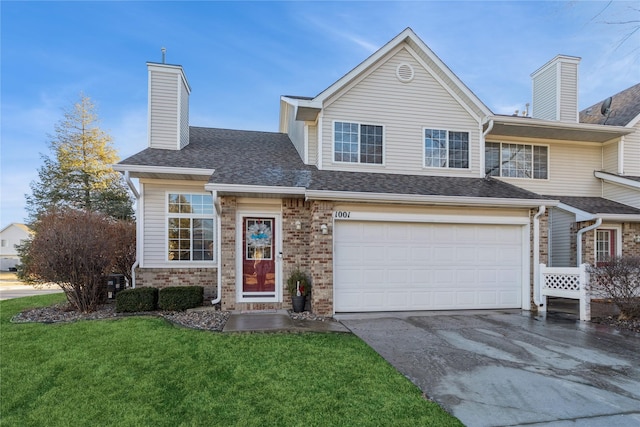 view of front of house with a garage and a front yard