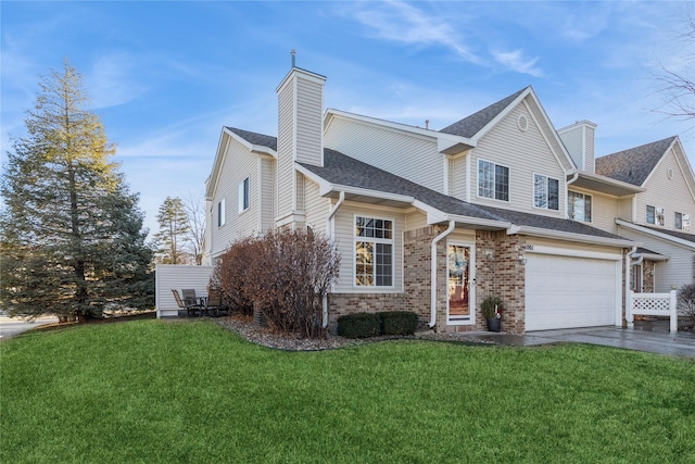 view of front of home featuring a garage and a front lawn