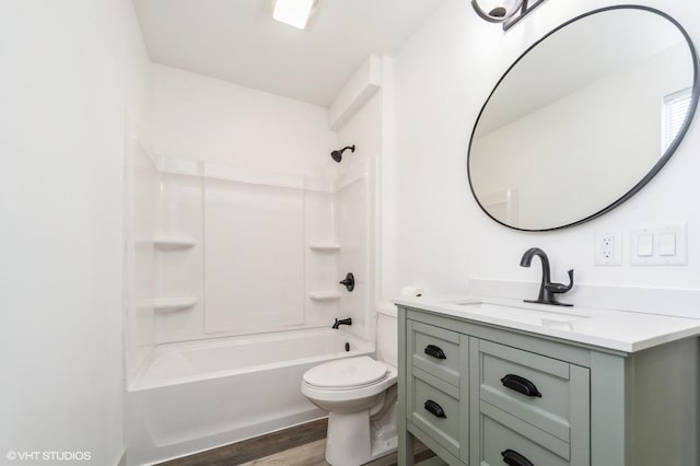 full bathroom with shower / bathtub combination, vanity, toilet, and hardwood / wood-style floors