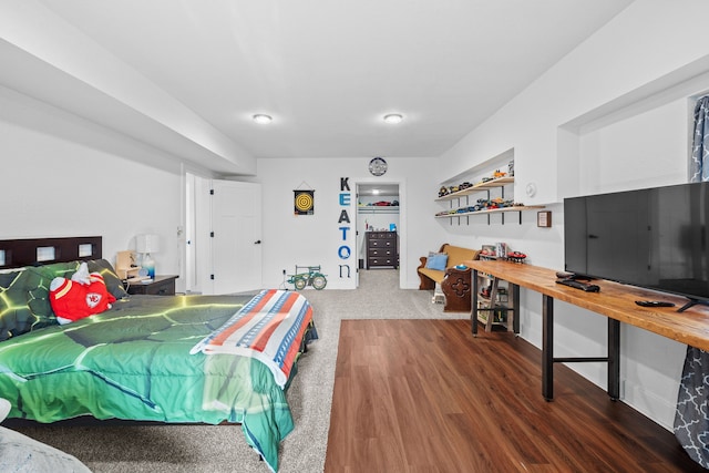 bedroom with dark hardwood / wood-style floors