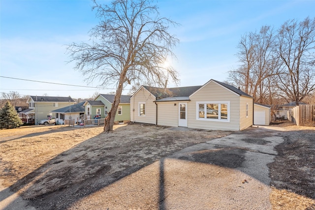 ranch-style house featuring a garage and a porch