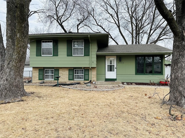 split level home with a front yard