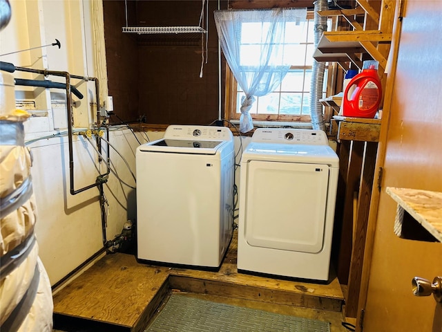 laundry room with independent washer and dryer