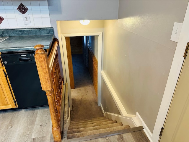 stairs with hardwood / wood-style floors