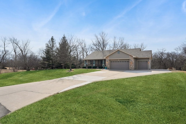 view of front of property featuring a garage and a front lawn