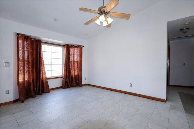 empty room with lofted ceiling and ceiling fan