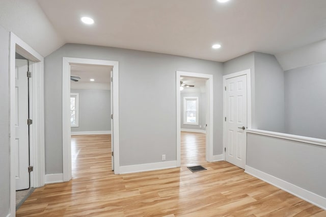 504 E Jackson Ave, Des Moines, IA 50315 - hall with light wood-type flooring, vaulted ceiling, and recessed lighting
