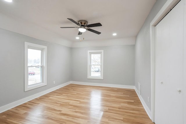 spare room with light wood-style flooring, recessed lighting, baseboards, and ceiling fan