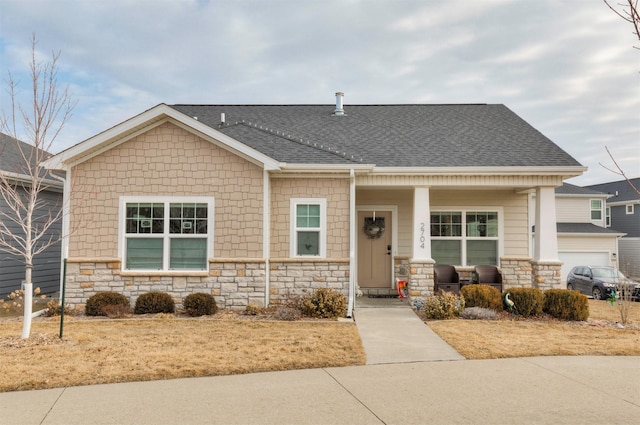 view of front of house featuring a garage and covered porch