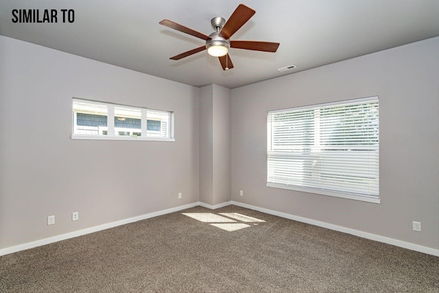 empty room featuring carpet flooring and ceiling fan