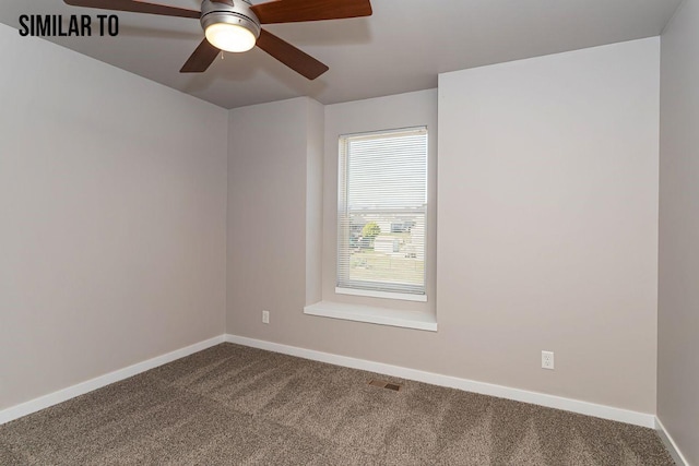 carpeted spare room with ceiling fan