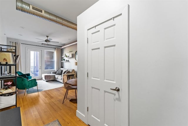 interior space featuring hardwood / wood-style flooring and ceiling fan