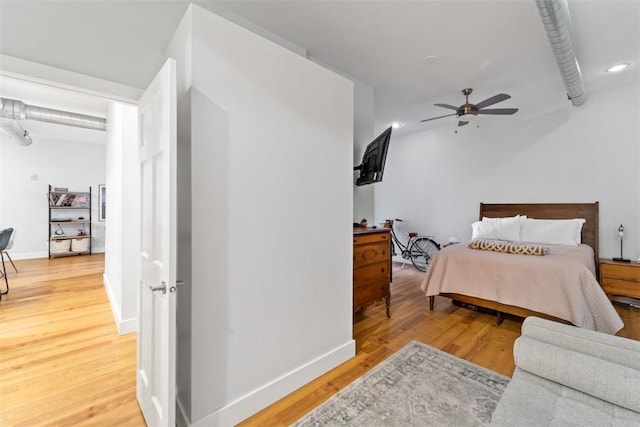 bedroom with wood-type flooring and ceiling fan