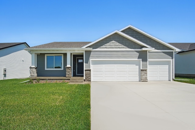 1939 Tuscany Dr SE, Altoona, IA 50009 - craftsman-style house featuring an attached garage, concrete driveway, a front lawn, and stone siding