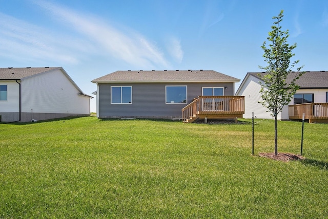 1939 Tuscany Dr SE, Altoona, IA 50009 - back of house featuring a wooden deck and a yard