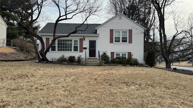 split level home featuring a front lawn