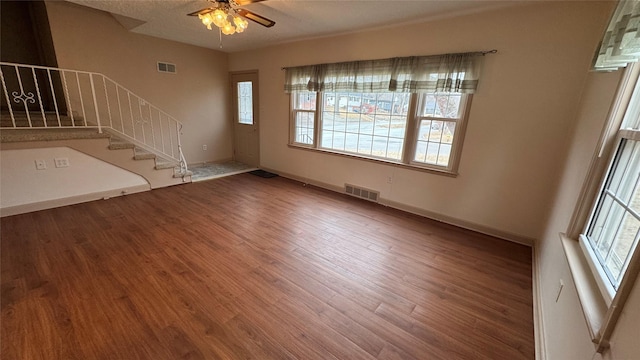 interior space featuring wood-type flooring and ceiling fan