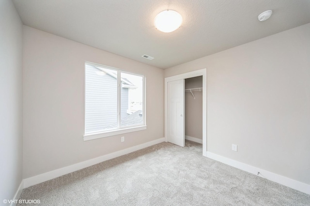 1461 S 91st St, West Des Moines, IA 50266 - unfurnished bedroom with carpet and a closet