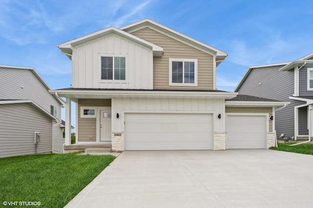 1461 S 91st St, West Des Moines, IA 50266 - view of front of house featuring board and batten siding, stone siding, concrete driveway, and a garage