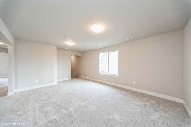 1461 S 91st St, West Des Moines, IA 50266 - unfurnished room with light colored carpet and a textured ceiling