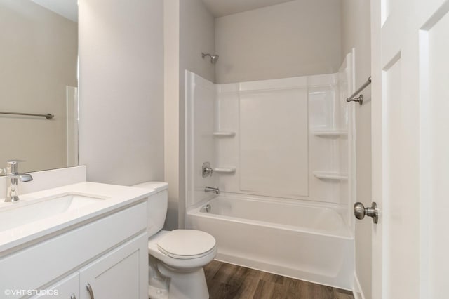 5616 Leyden Ave, Des Moines, IA 50317 - bathroom featuring vanity, wood finished floors, and shower / bathtub combination