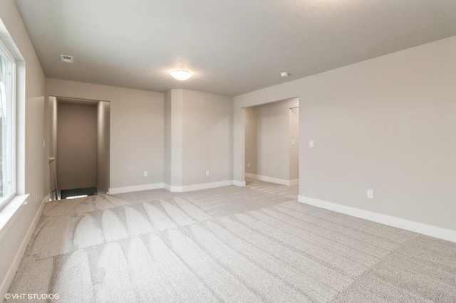 5616 Leyden Ave, Des Moines, IA 50317 - unfurnished room with light carpet and a smoke detector