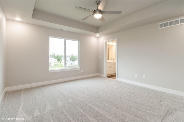 5616 Leyden Ave, Des Moines, IA 50317 - carpeted empty room with a ceiling fan and a raised ceiling