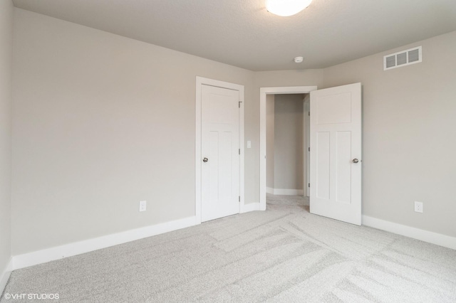 5616 Leyden Ave, Des Moines, IA 50317 - unfurnished bedroom with carpet floors and baseboards