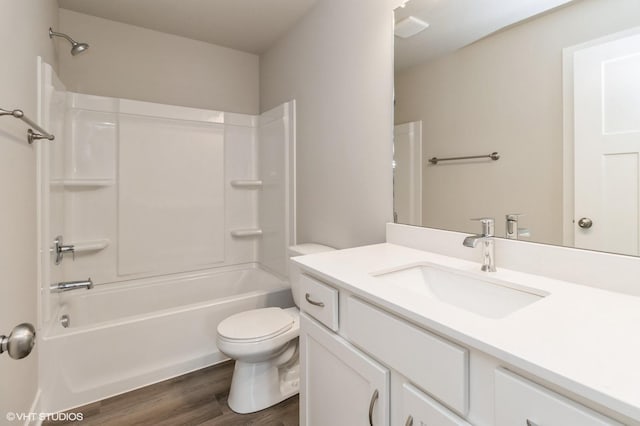 5616 Leyden Ave, Des Moines, IA 50317 - full bath featuring vanity, wood finished floors, and tub / shower combination
