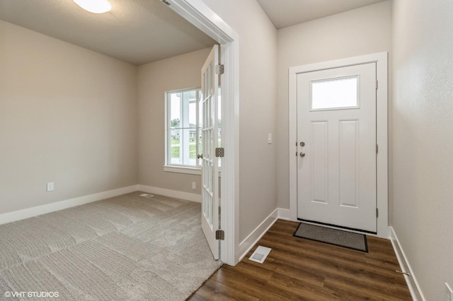 5656 Brook View Ave, Des Moines, IA 50317 - entrance foyer featuring baseboards and dark wood-style floors