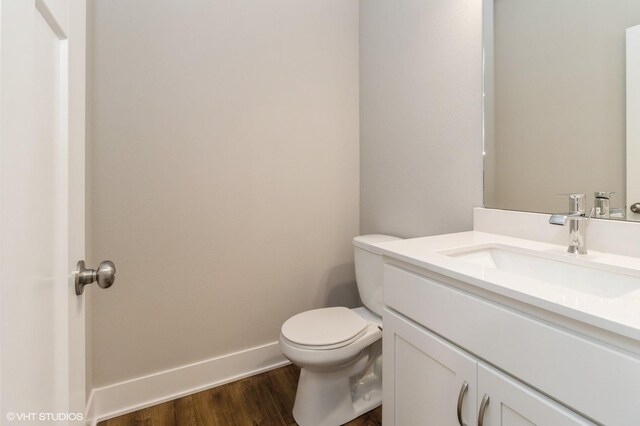 5656 Brook View Ave, Des Moines, IA 50317 - half bathroom featuring vanity and wood finished floors