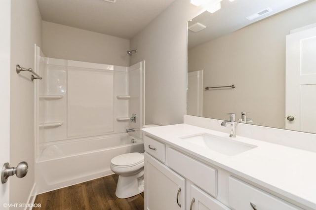 5656 Brook View Ave, Des Moines, IA 50317 - bathroom featuring vanity, wood finished floors, and shower / bath combination