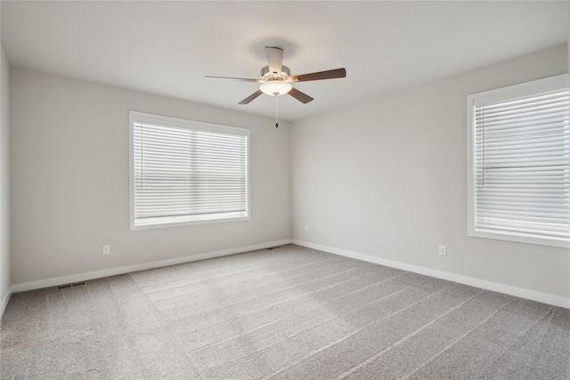 carpeted empty room with ceiling fan