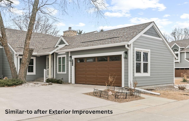 ranch-style home featuring a garage