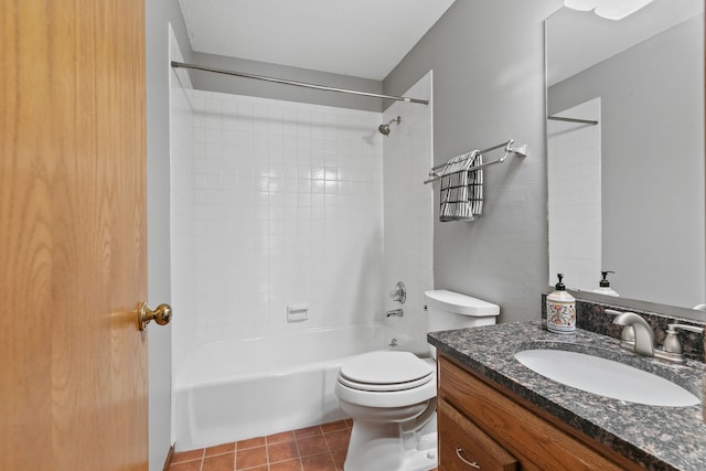 full bathroom with vanity, tiled shower / bath, tile patterned floors, and toilet