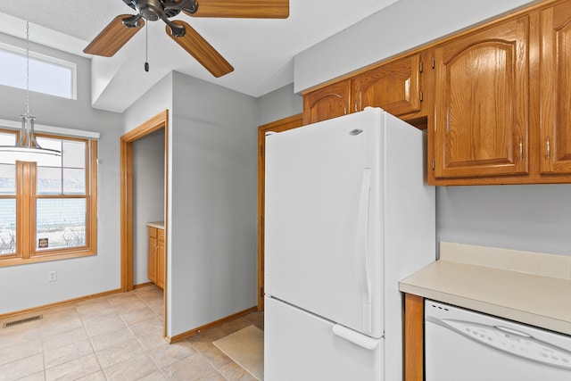 kitchen with ceiling fan and white appliances