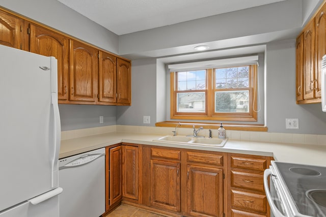 kitchen with sink and white appliances