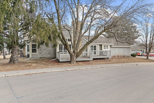 view of front of property with central AC and a deck