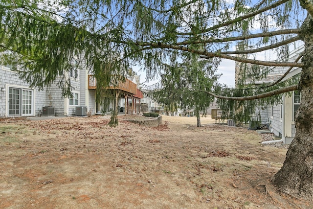 view of yard with central air condition unit